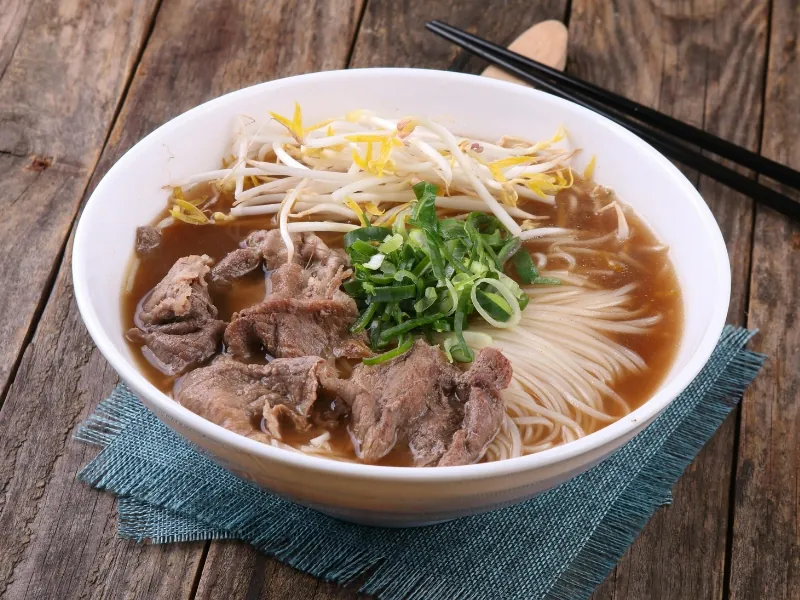 Authentic beef pho with tender beef in fragrant broth at Pho Highland, a Vietnamese Restaurant in Highland